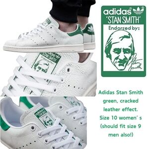 Adidas Stan Smith cracked leather effect shoes.
